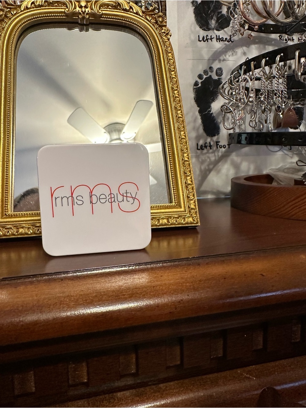 RMS Beauty compact in white with red logo